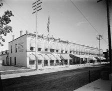 Commercial block with mineral bath house at left, probably Ypsilanti, Michigan, c1900-1910. Creator: Unknown