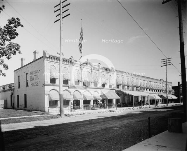 Commercial block with mineral bath house at left, probably Ypsilanti, Michigan, c1900-1910. Creator: Unknown.