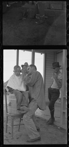 Community barber shop in Kern County migrant camp, California, 1936. Creator: Dorothea Lange