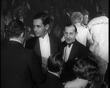Composer Irving Berlin Talking to Two Male Civilians, 1924. Creator: British Pathe Ltd