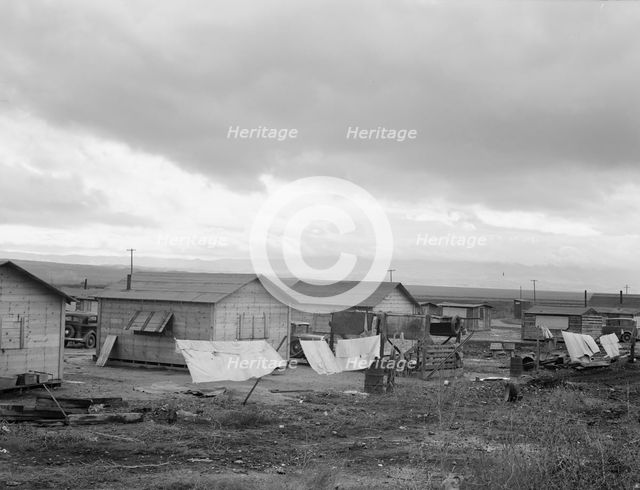 "Company" cotton pickers' camp after picking season, Buttonwillow, California , 1939. Creator: Dorothea Lange.