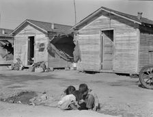 Company housing for cotton workers near Corcoran, California, 1936. Creator: Dorothea Lange