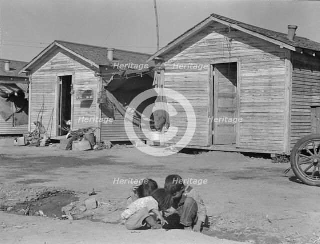 Company housing for cotton workers near Corcoran, California, 1936. Creator: Dorothea Lange.