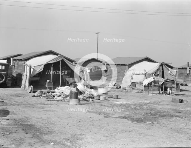 Company housing for cotton workers near Corcoran, California, 1936. Creator: Dorothea Lange.
