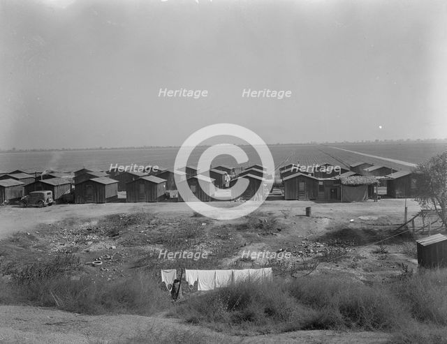 Company housing for Mexican cotton pickers, South of Corcoran, California, 1936. Creator: Dorothea Lange.