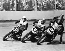 Competitors in a dirt track race, America