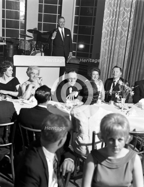 Compere at a social evening, Doncaster, South Yorkshire, 1964.  Creator: Michael Walters.