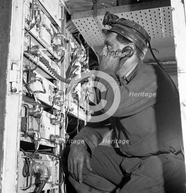 Comunications, a miner from Bevercotes Colliery, Nottinghamshire, 1967.  Creator: Michael Walters.