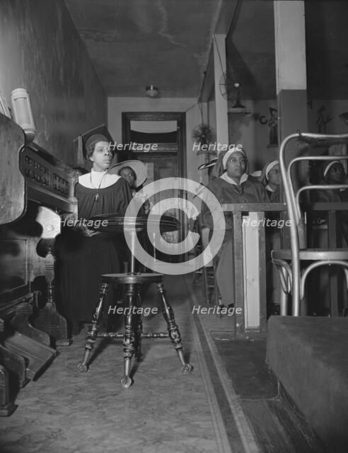 Congregation of the St. Martin's Spiritual Church, Washington, D.C., 1942. Creator: Gordon Parks.