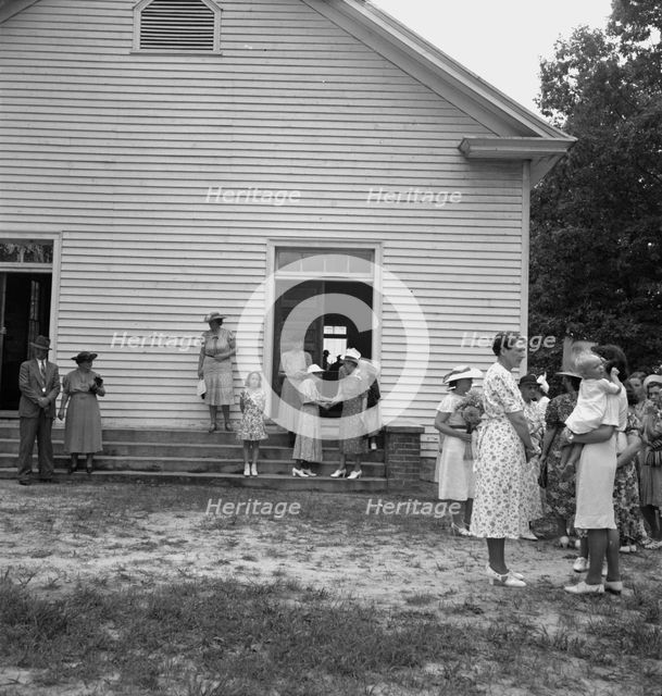 Congregation entering church, Wheeley's Church, Person County, North Carolina, 1939. Creator: Dorothea Lange.