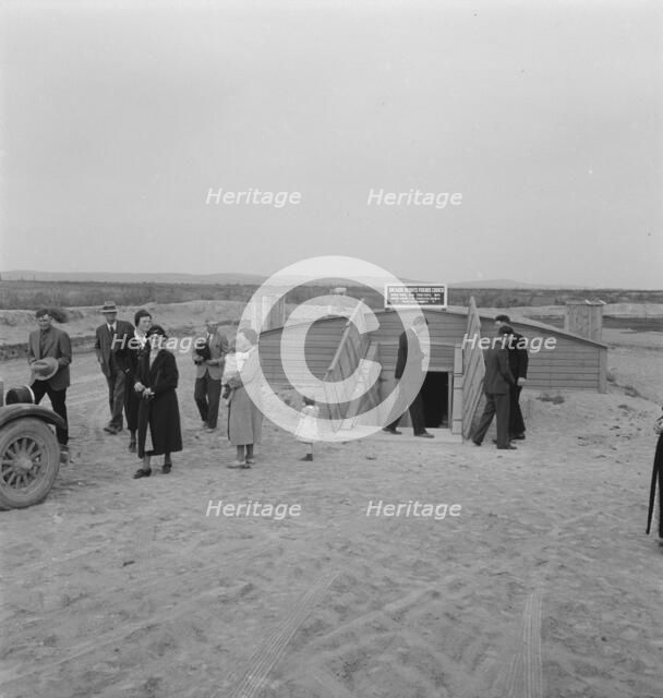 Congregation leaving after services, Dead Ox Flat, Malheur County, Oregon, 1939. Creator: Dorothea Lange.
