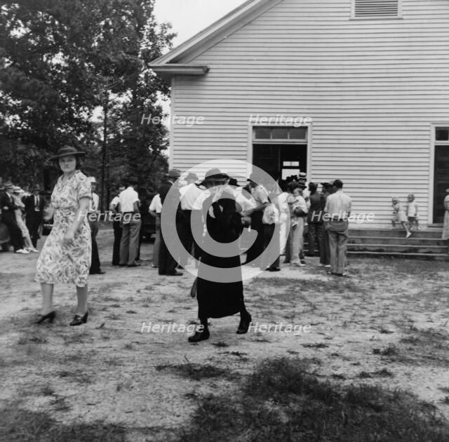 Congregation leaving for home after services, Wheeley's Church, Person County, North Carolina, 1939. Creator: Dorothea Lange.