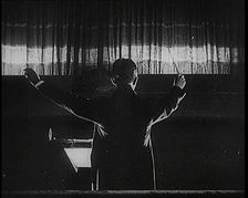 Conductor and Orchestra Performing As the Curtain Raises, 1920s. Creator: British Pathe Ltd