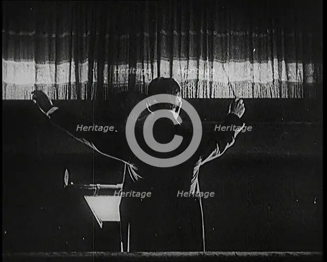 Conductor and Orchestra Performing As the Curtain Raises, 1920s. Creator: British Pathe Ltd.