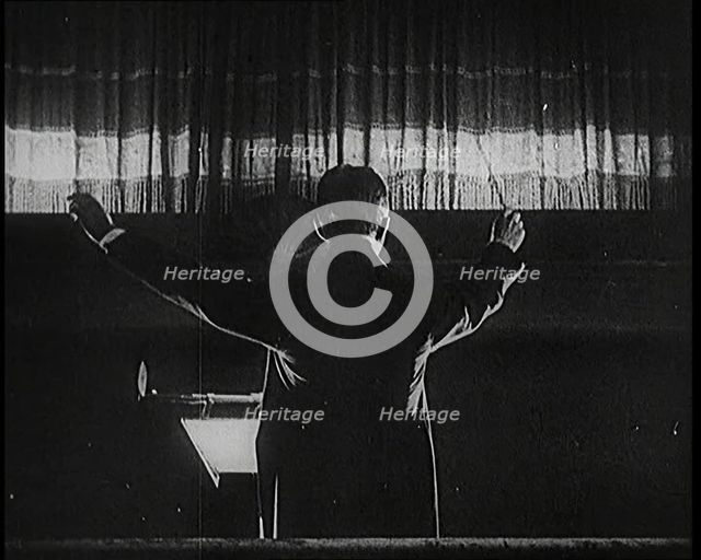 Conductor and Orchestra Performing As the Curtain Raises, 1920s. Creator: British Pathe Ltd.