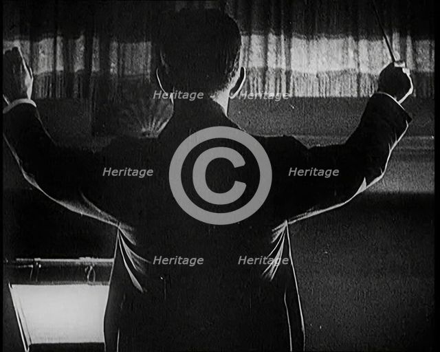 Conductor Starting a Show in London, 1922. Creator: British Pathe Ltd.