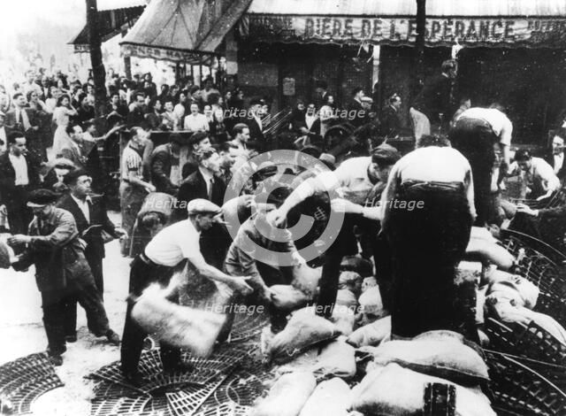 Constructing a barricade, Paris, 1944. Artist: Unknown