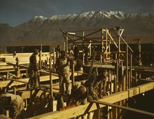 Constructing a building on the site of a new steel mill..., Columbia Steel Co., Geneva, Utah, 1942. Creator: Andreas Feininger