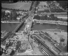 Construction of the new Hampton Court Bridge alongside the old one, Hampton Court, London, c1930s. Creator: Arthur William Hobart