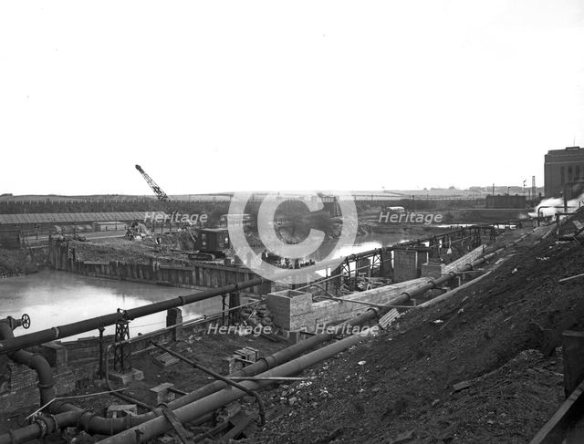 Construction of the reservoir, Manvers Main Colliery, Wath upon Dearne, South Yorkshire, 1955. Creator: Michael Walters.