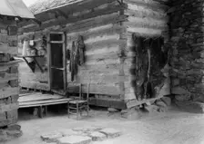 Construction detail of double log cabin of Negro share tenants, Person County, North Carolina, 1939. Creator: Dorothea Lange