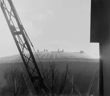 Construction workers on the roof of the Dome of Discovery, Festival of Britain, London, 1951. Creator: Henry Grant