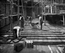 Construction workers laying a hollow pot floor, 8 Lloyds Avenue, City of London, 1907. Artist: Bedford Lemere and Company