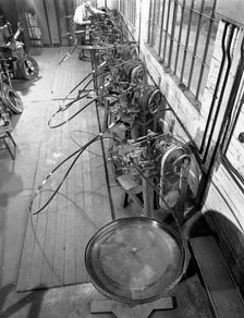Continuous sharpening of longsaw blades, Slack Sellars & Co, Sheffield, South Yorkshire, 1963. Creator: Michael Walters