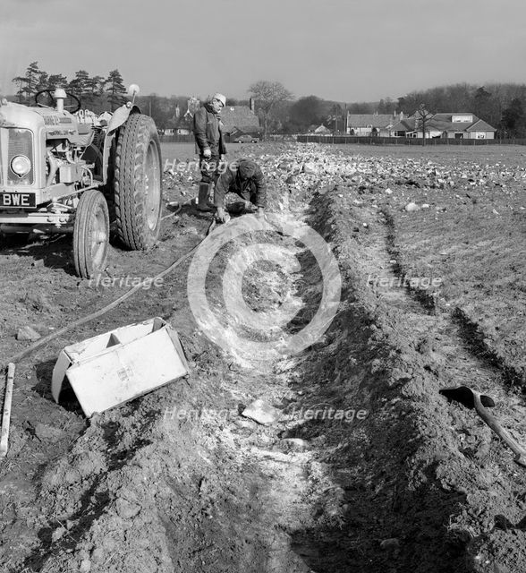 Contractors setting explosives in a trench in Firbeck, near Rotherham, 1962.  Creator: Michael Walters.