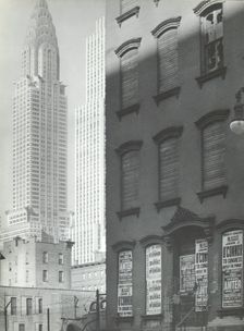 Contrasting No. 331 East 39th Street with the Chrysler building (left) and the Daily News..., 1938. Creator: Berenice Abbott