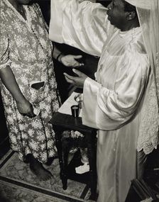 Contributions are made by all who receive the blessing and annointment..., Washington, D.C., 1942. Creator: Gordon Parks