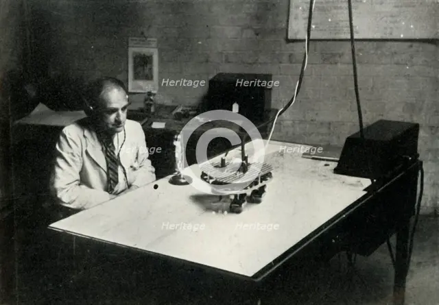 Control desk at an RAF flight training school, 1941. Creator: Charles Brown.