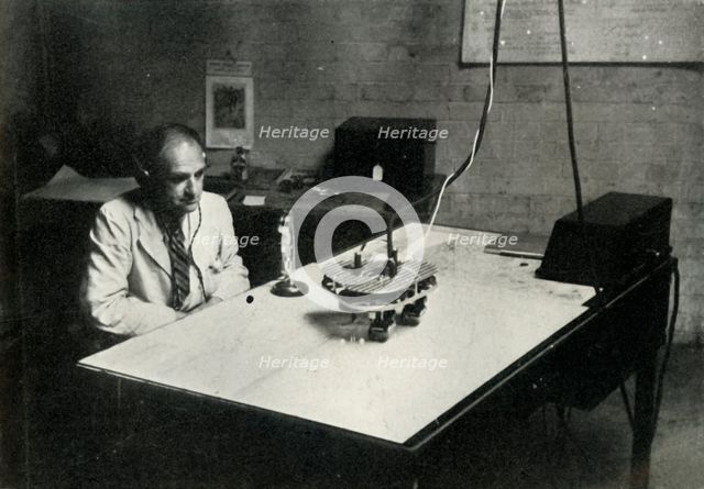 Control desk at an RAF flight training school, 1941. Creator: Charles Brown.