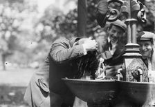 Cooling his head - N.Y. on hot day, between c1910 and c1915. Creator: Bain News Service