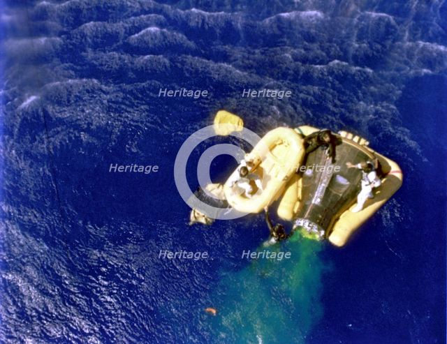 Cooper and Conrad await recovery relicopter, 1965.  Creator: NASA.