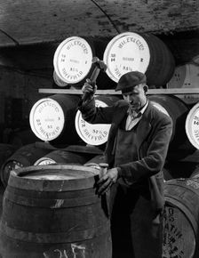 Coopering, making whiskey barrels at Wiley & Co, Sheffield, South Yorkshire, 1961. Creator: Michael Walters