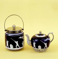 Copeland Spode biscuit barrel and teapot decorated with images of golfers, c1905. Creator: Copeland Spode