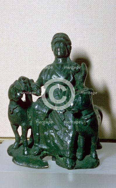 Copper alloy figure of the goddess Epona, seated between two ponies, from Wiltshire, England. Artist: Unknown