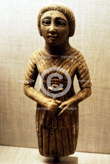 Coptic figure of woman clasping a crucifix, Sheik Ibada, Upper Egypt, 350-400. Artist: Unknown.