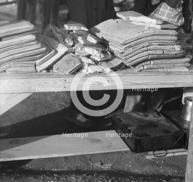 Cornbread, Food for flood refugees at the Forrest City concentration camp, Arkansas, 1937. Creator: Walker Evans.