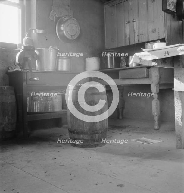 Corner of Roberts' one-room basement dugout, Malheur County, Oregon, 1939. Creator: Dorothea Lange.