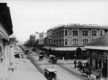 Corner Queen and Albert Street, Brisbane, 1886 (showing Grimes and Petty Clothing/Drapery Store). Creator: Unknown