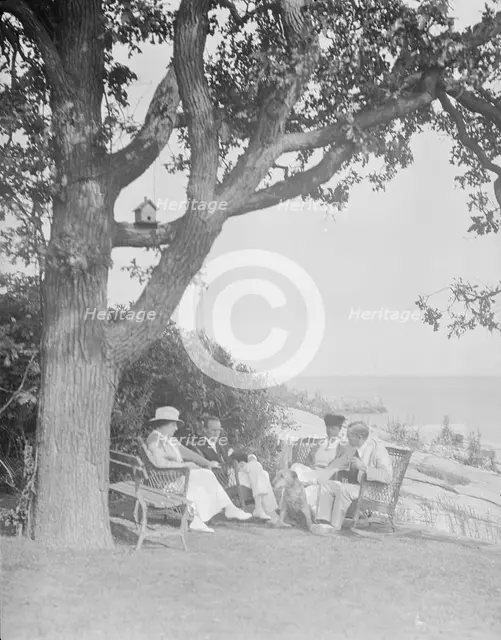 Cosgrave group seated outdoors, 1917 Creator: Arnold Genthe.