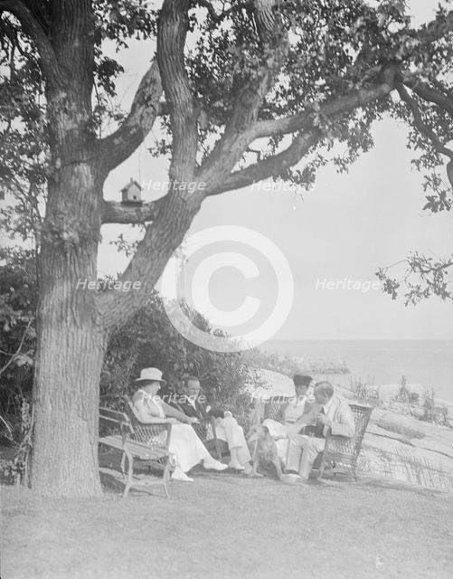 Cosgrave group seated outdoors, 1917 Creator: Arnold Genthe.