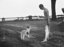Cosgrave, Mr., with dog, outdoors, not before 1917. Creator: Arnold Genthe