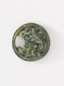 Costume ornament: dragon in roundel (pair with F1917.565), Goryeo period, 12th-13th century. Creator: Unknown