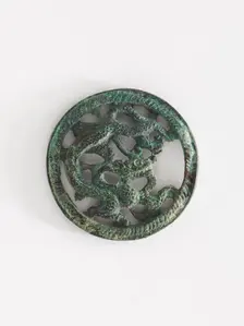 Costume ornament: dragon in roundel (pair with F1917.566), Goryeo period, 12th-13th century. Creator: Unknown