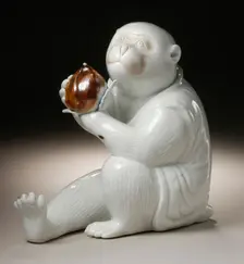 Costumed Monkey Holding a Chestnut, 19th century. Creator: Unknown