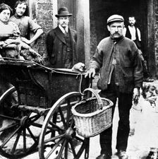 Cat's meat man in an East End street, London, c1902. Creator: John Galt