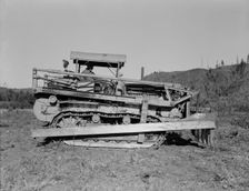 Caterpillar clearing land on cut...western Washington farm, Lewis County, Western Washington, 1939. Creator: Dorothea Lange